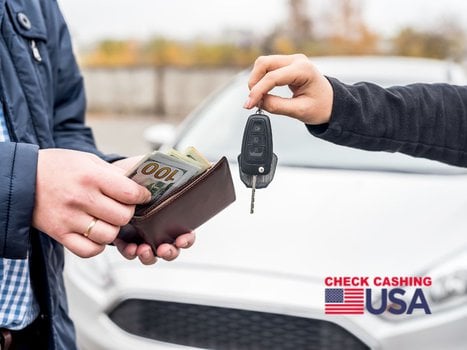 man is paying cash for auto repairs